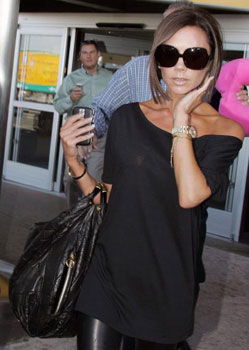 Victoria Beckham and her Rolex Day-Date Presidential Champagne Stick Watch